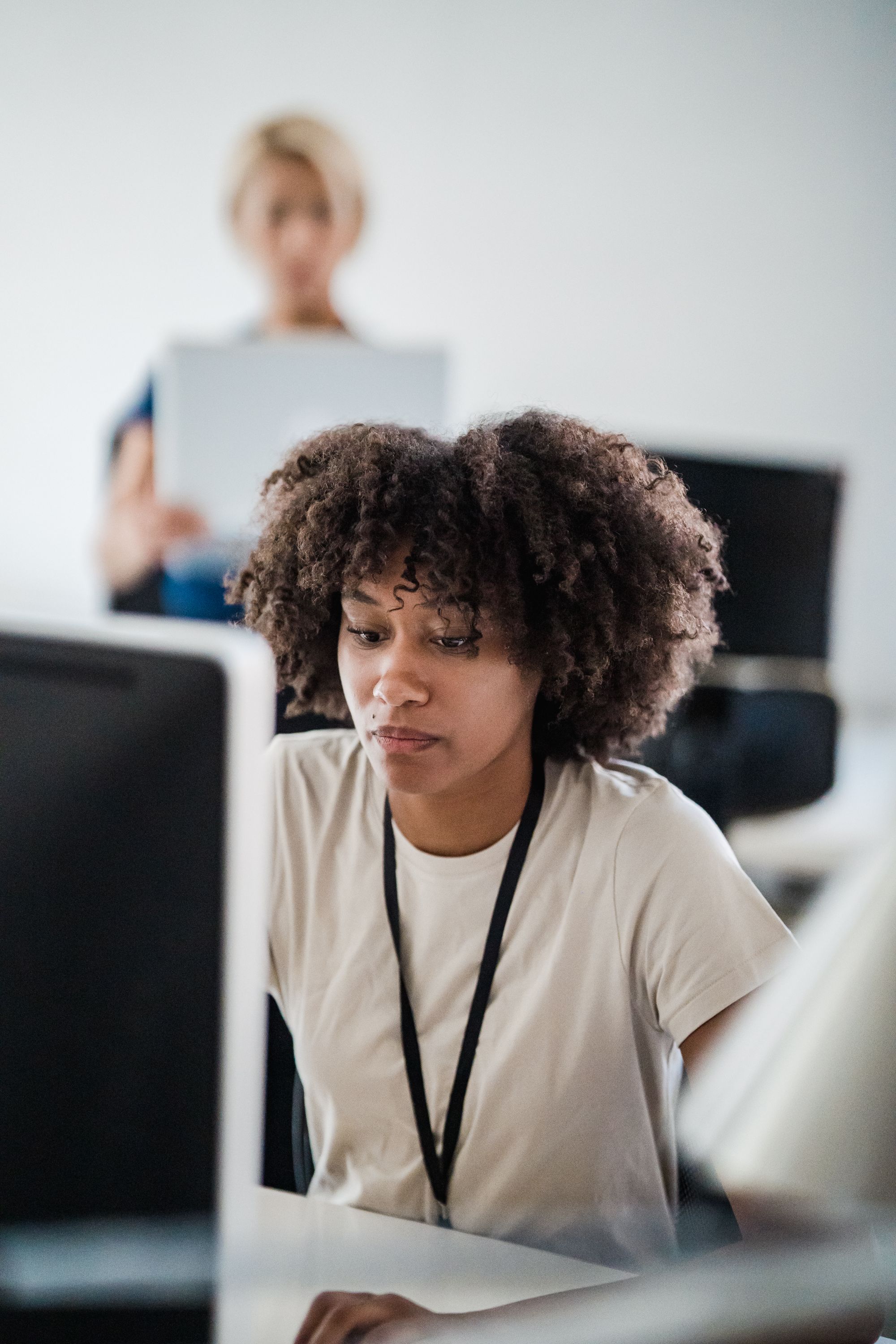 A professional concentrating on analysis at a computer